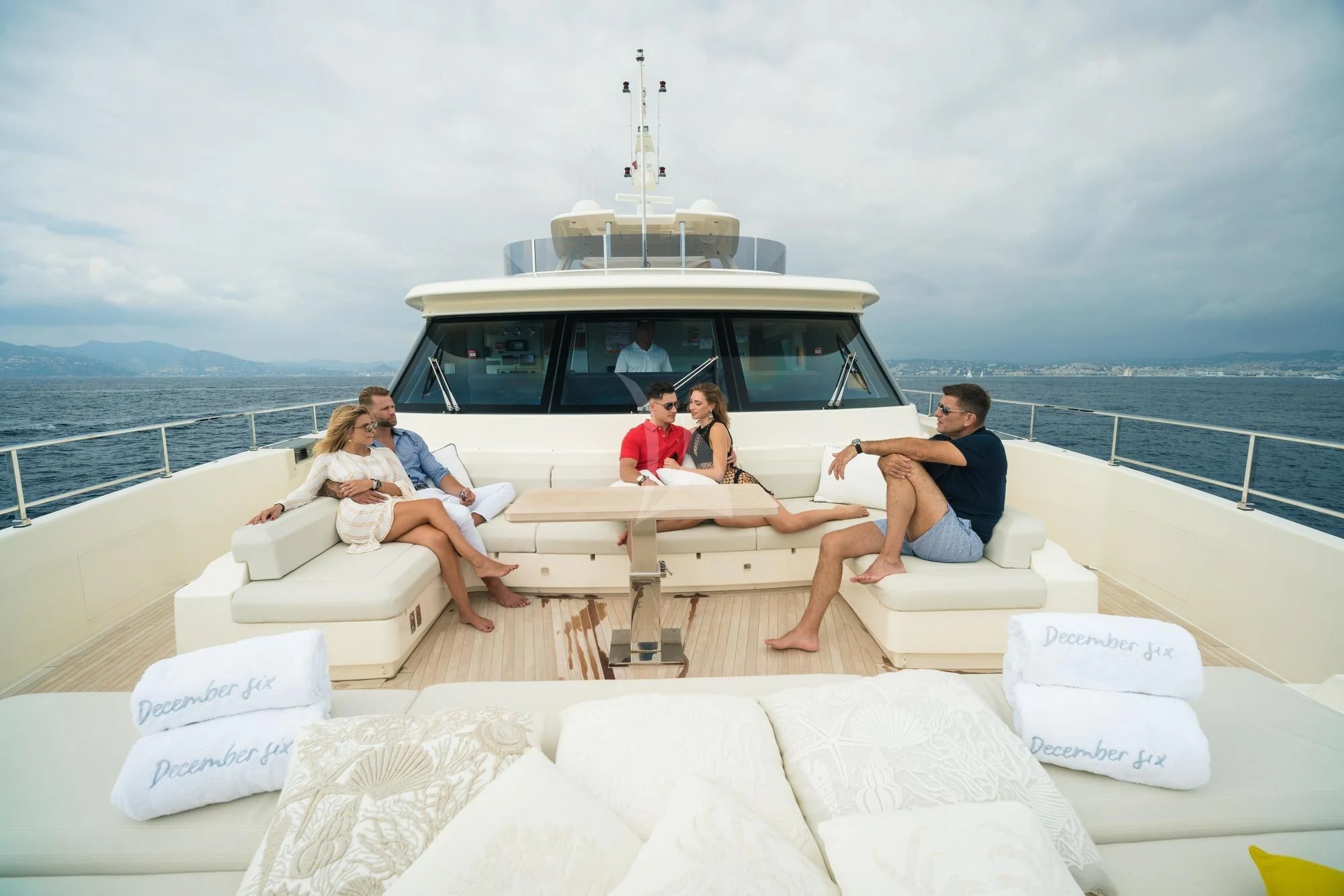 a group of people sitting on a boat on the water aboard NEWAL Yacht for Sale