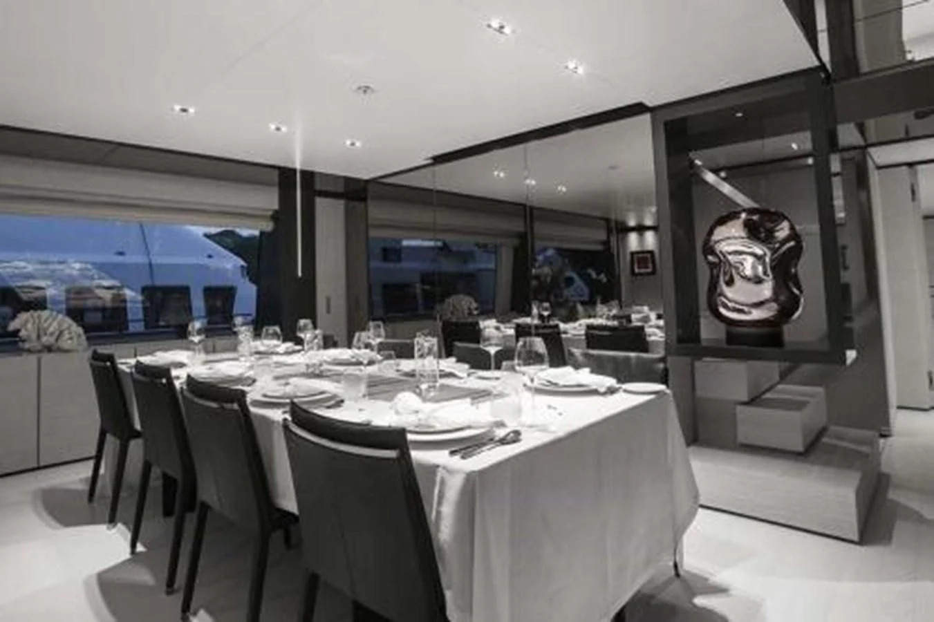 a large dining room with a large table and chairs aboard NEWAL Yacht for Sale