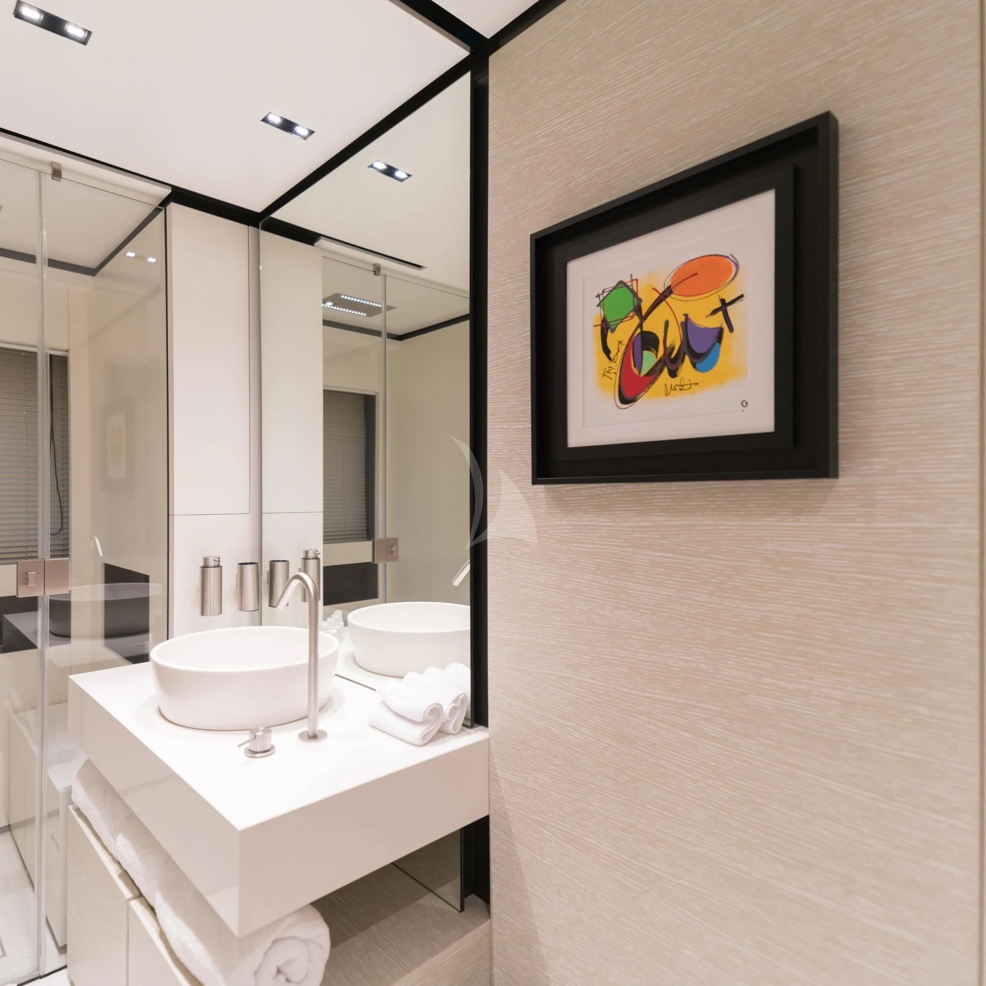 a bathroom with a sink and a painting on the wall aboard NEWAL Yacht for Sale