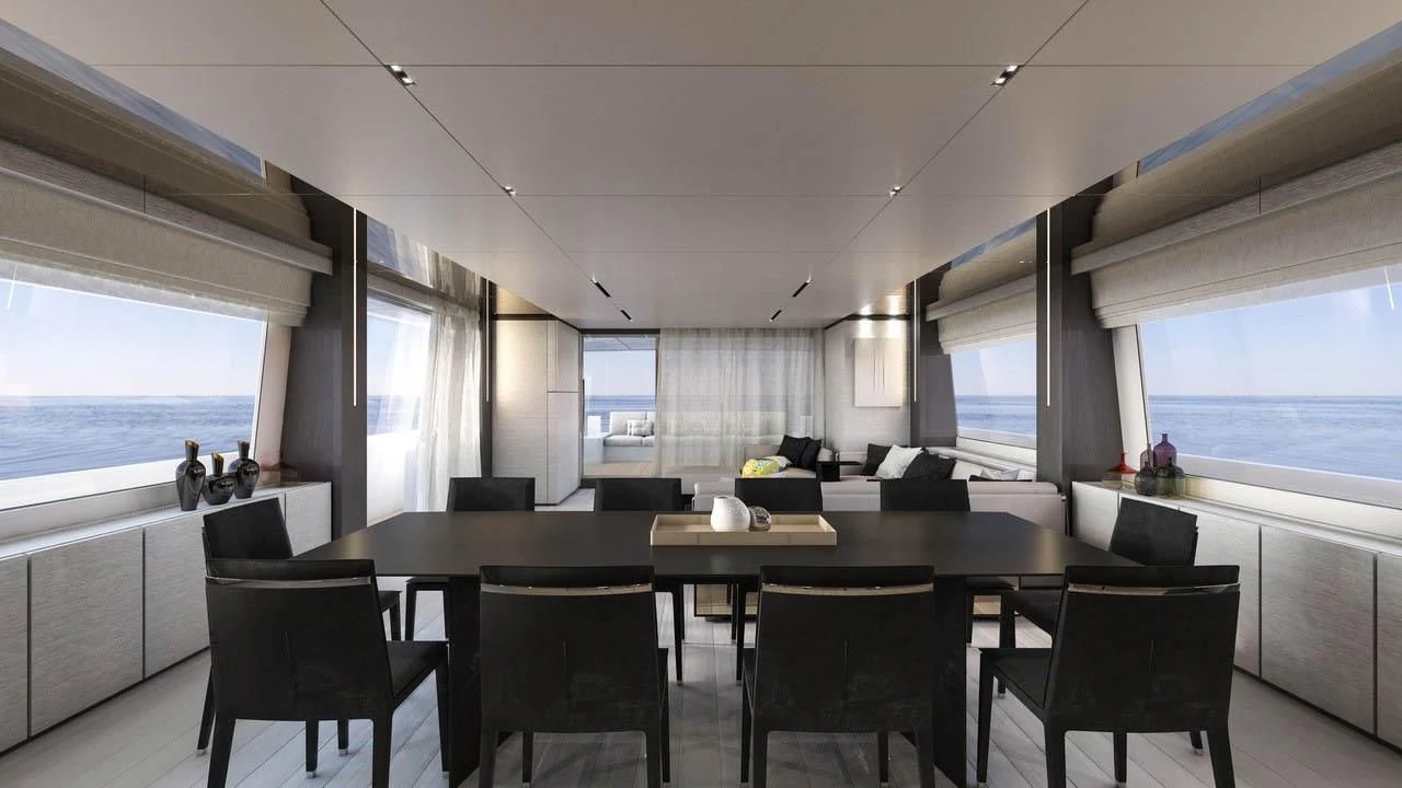 a room with a table and chairs aboard NEWAL Yacht for Sale