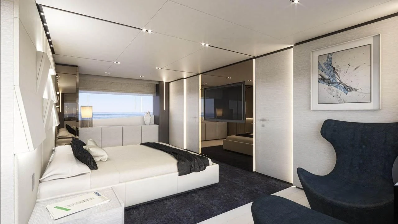 a room with a bed and a chair aboard NEWAL Yacht for Sale