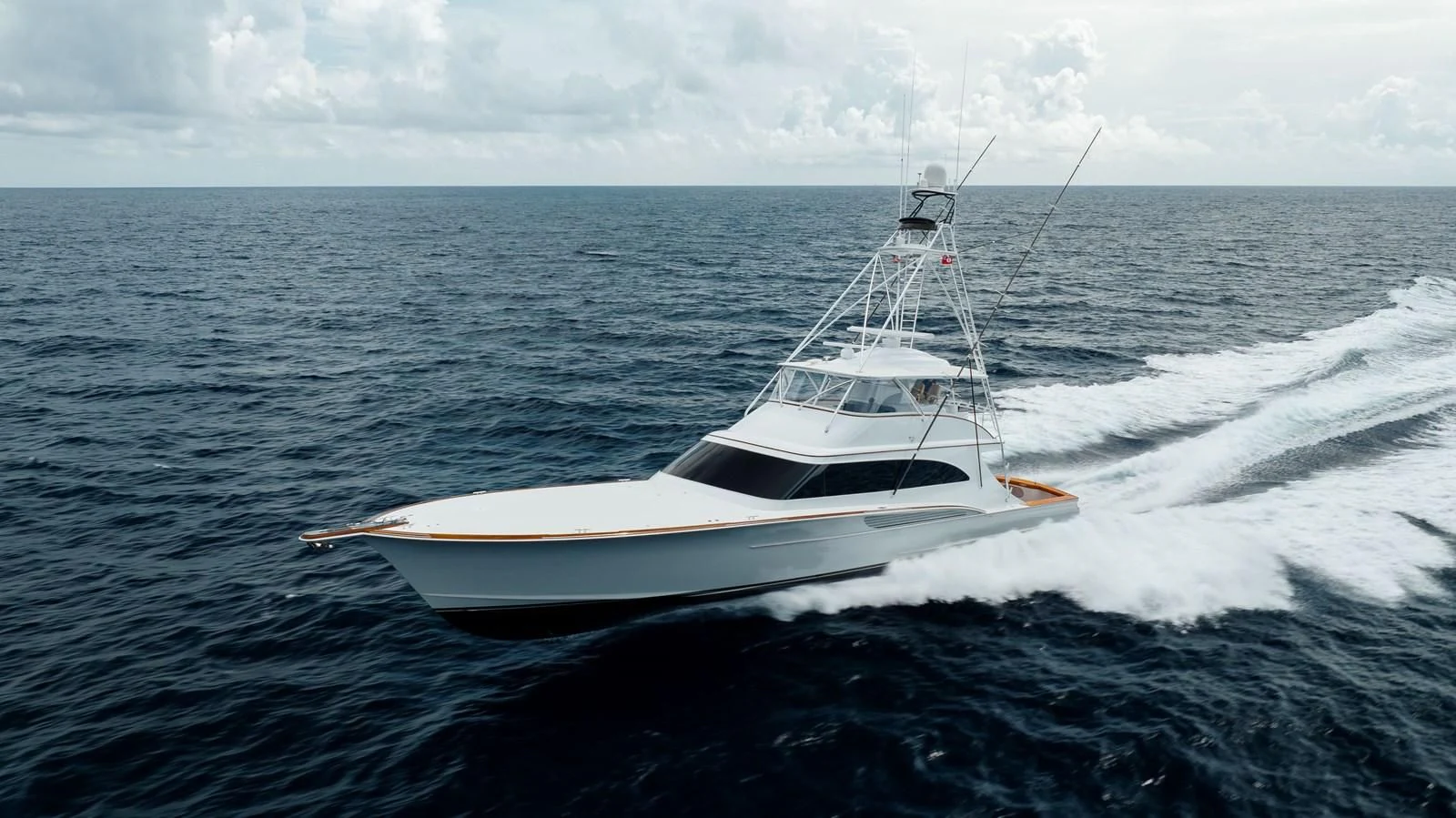 a white boat on the water aboard JARUCO Yacht for Sale