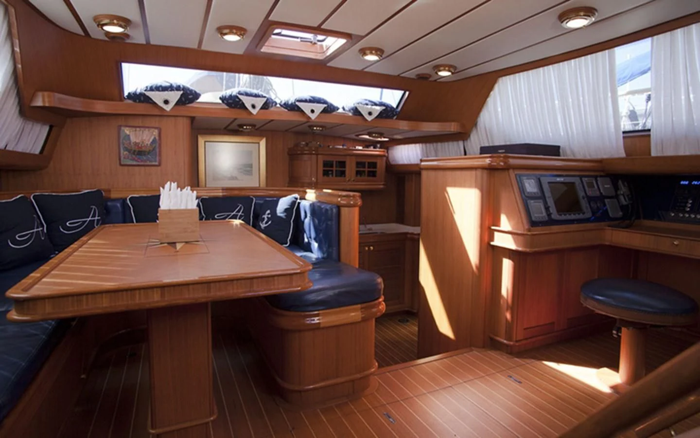 a room with a table and chairs aboard ARCADIA 3 Yacht for Sale
