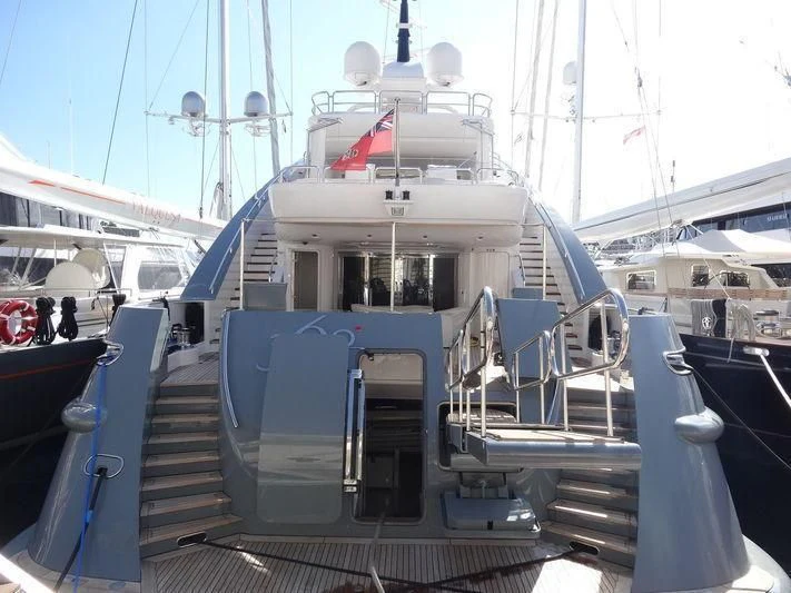 a boat with a flag on the deck aboard LADY MM Yacht for Sale