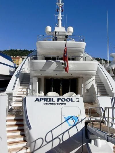 a large white boat with a red stripe on the front aboard LADY MM Yacht for Sale