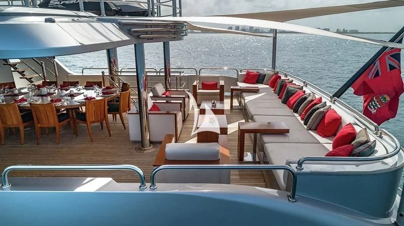 a boat with a deck and chairs aboard ODESSA Yacht for Sale