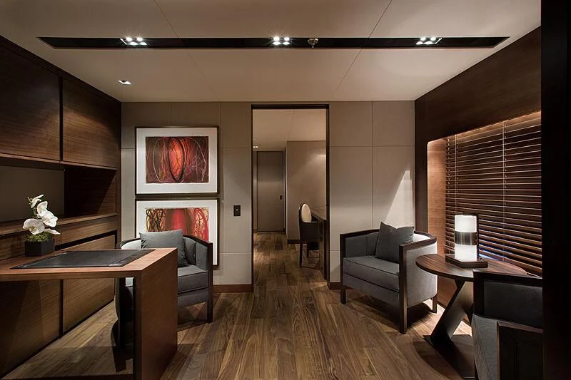 a living room with a wood floor aboard ODESSA Yacht for Sale