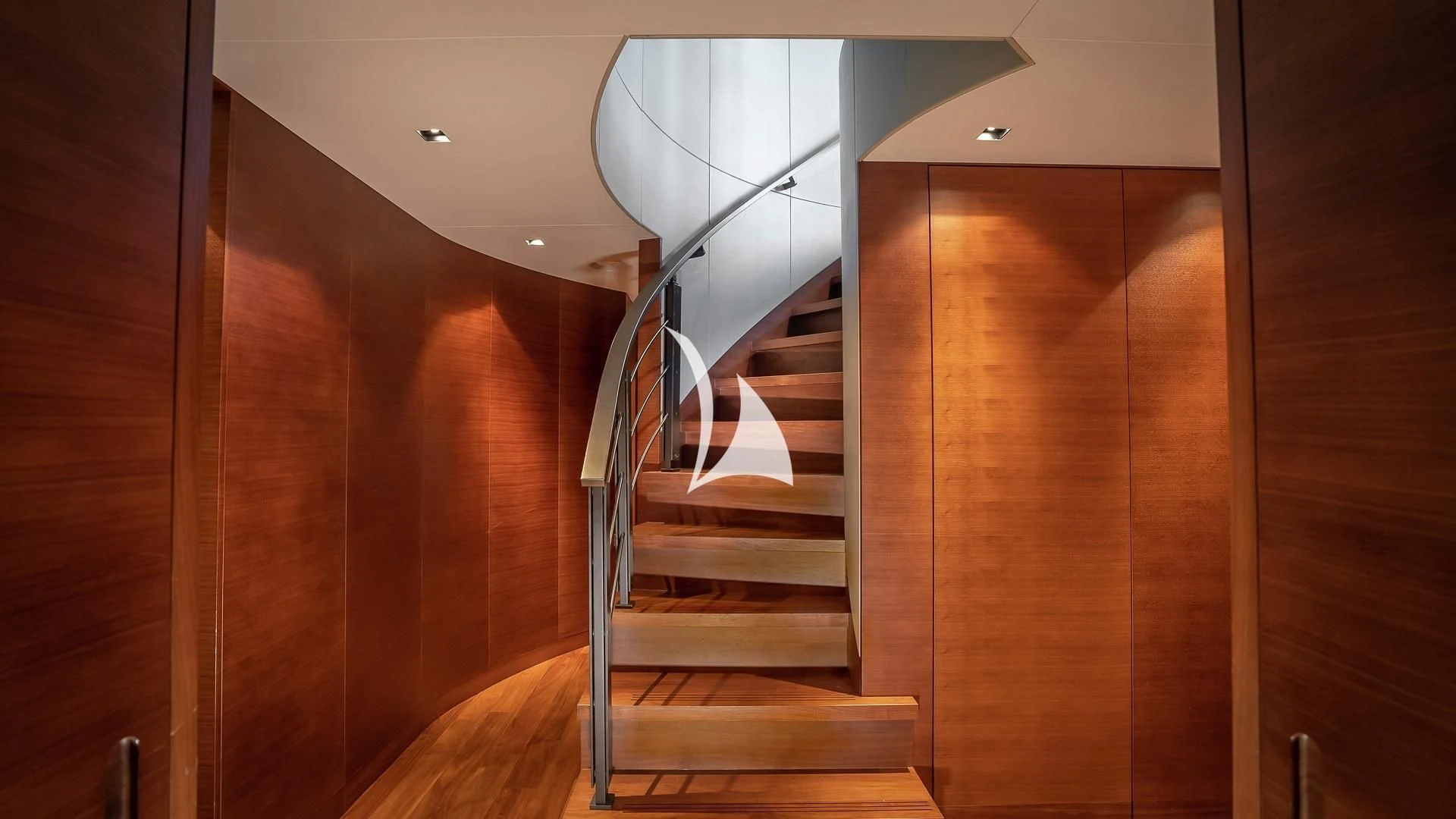 a wooden staircase in a house aboard ODESSA Yacht for Sale