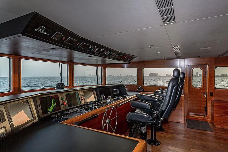 a room with a table and chairs aboard ODESSA Yacht for Sale