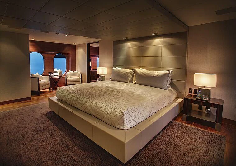 a large bed in a room aboard ODESSA Yacht for Sale