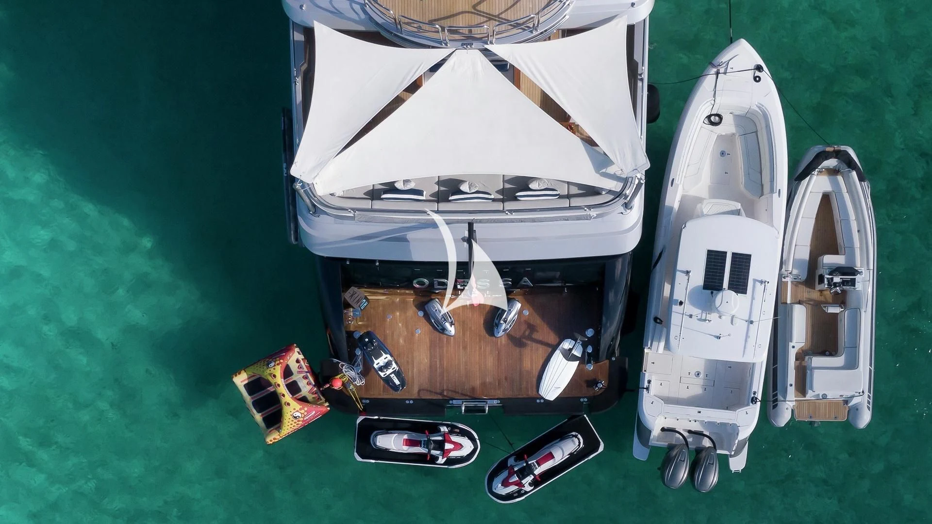 a group of suitcases on a green surface aboard ODESSA Yacht for Sale