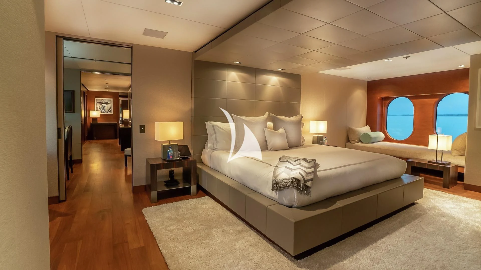 a large bedroom with a large bed aboard ODESSA Yacht for Sale