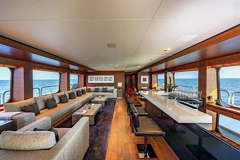 a large living room with a large window aboard ODESSA Yacht for Sale