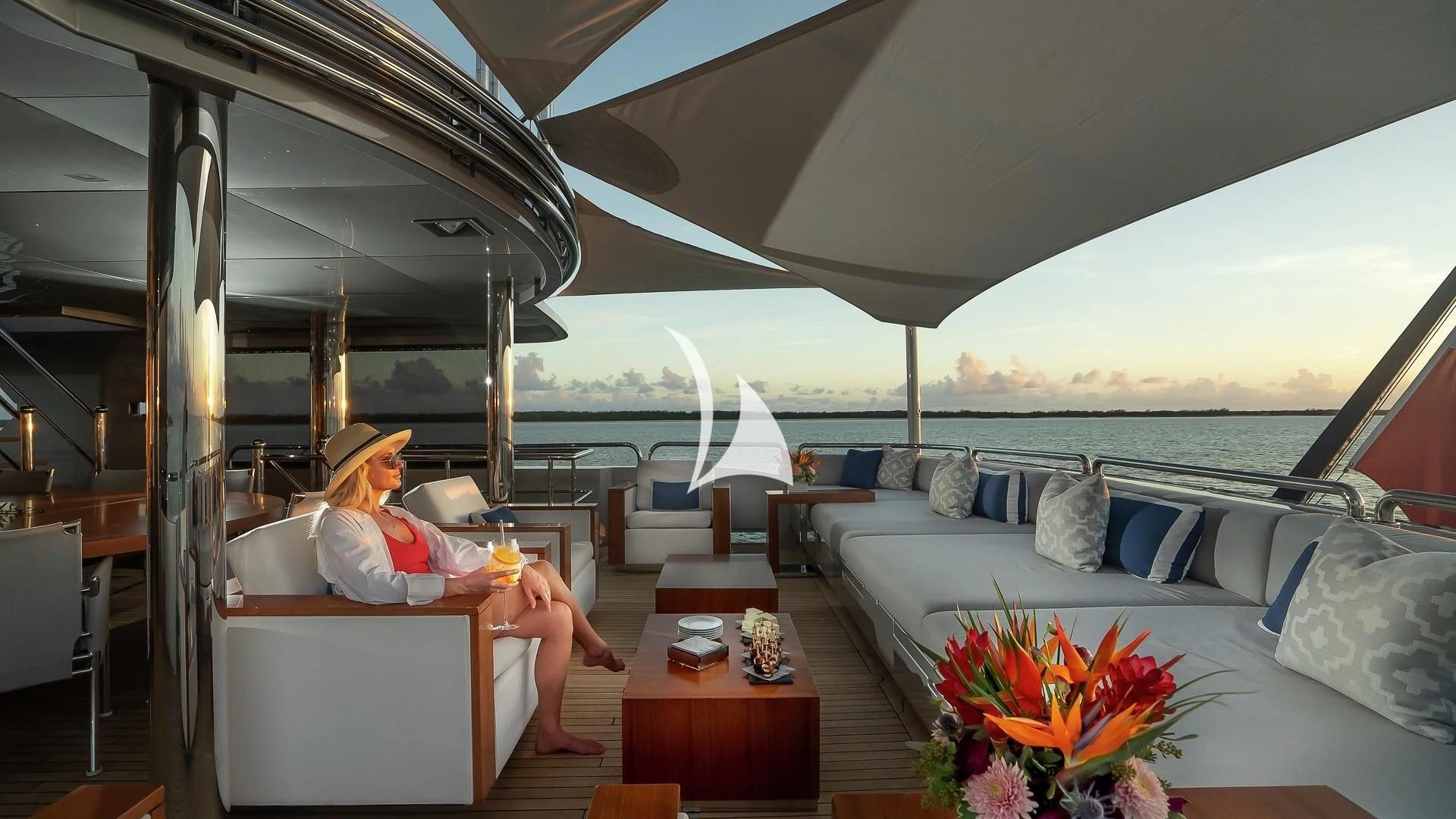 a person sitting at a table on a boat aboard ODESSA Yacht for Sale