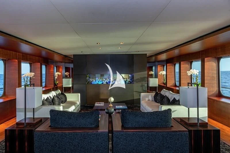 a living room with a large screen aboard ODESSA Yacht for Sale