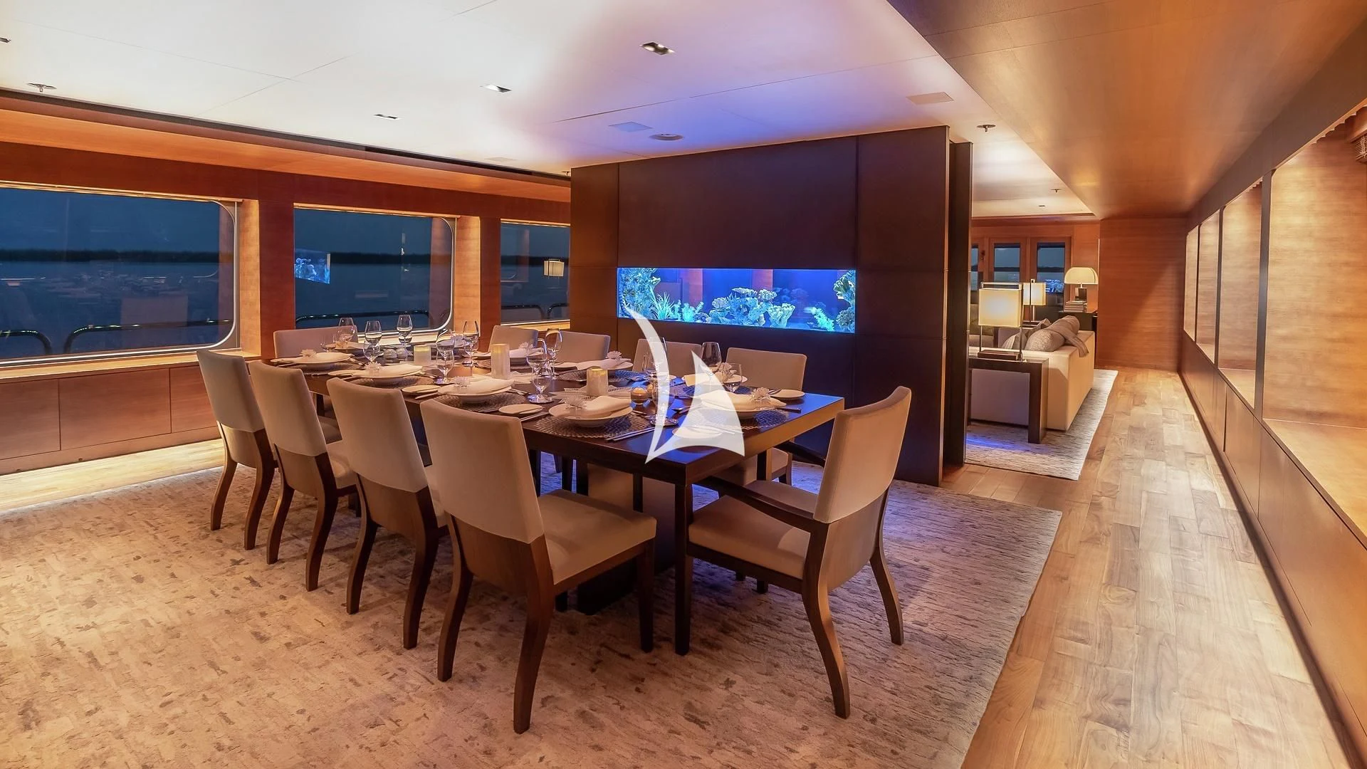 a room with tables and chairs aboard ODESSA Yacht for Sale