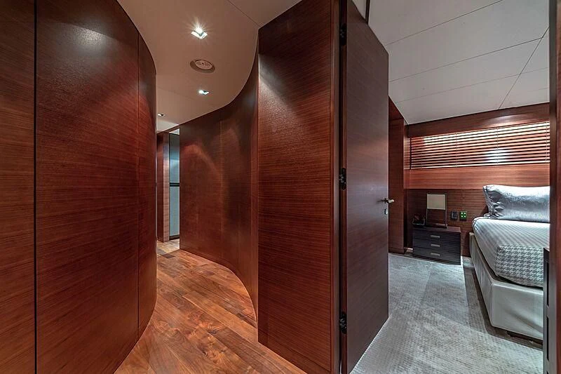 a room with a bed and a wood door aboard ODESSA Yacht for Sale