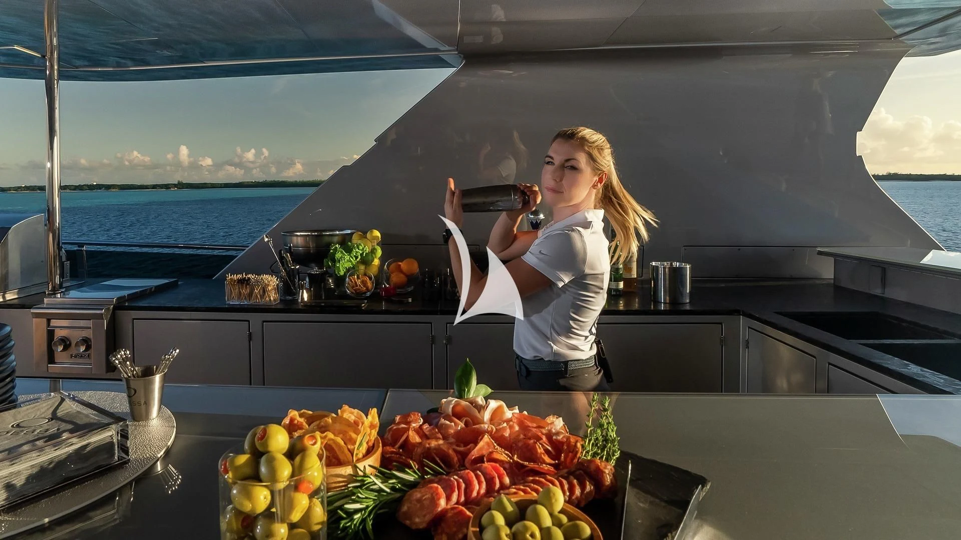 a woman holding a pan aboard ODESSA Yacht for Sale