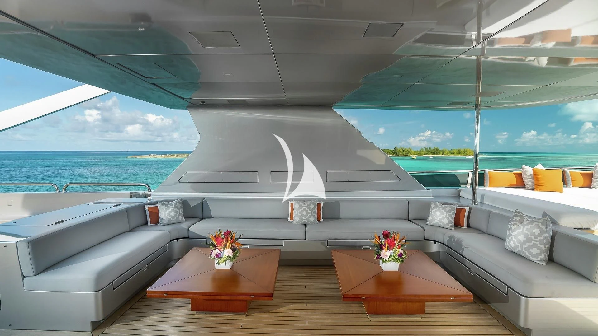 a room with a couch and a table and a window aboard ODESSA Yacht for Sale