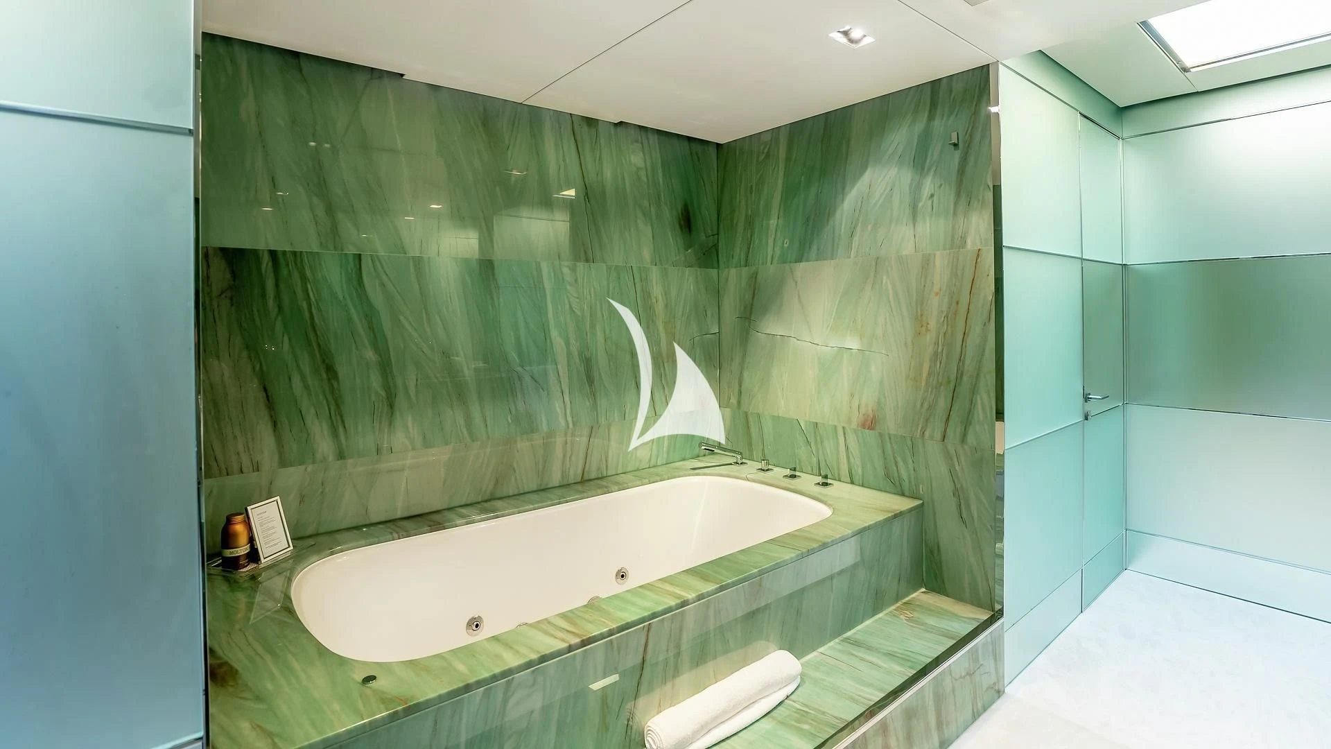 a bathroom with a large bathtub aboard ODESSA Yacht for Sale