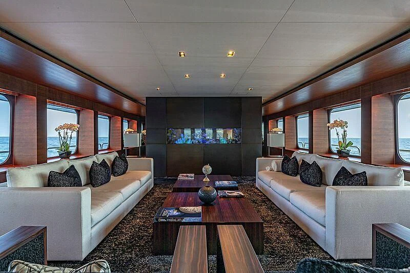 a living room with a couch and a table aboard ODESSA Yacht for Sale