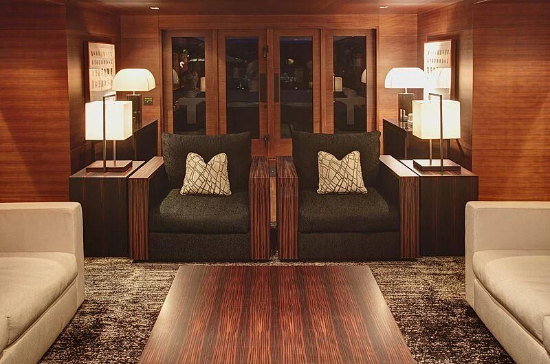 a living room with a large mirror aboard ODESSA Yacht for Sale
