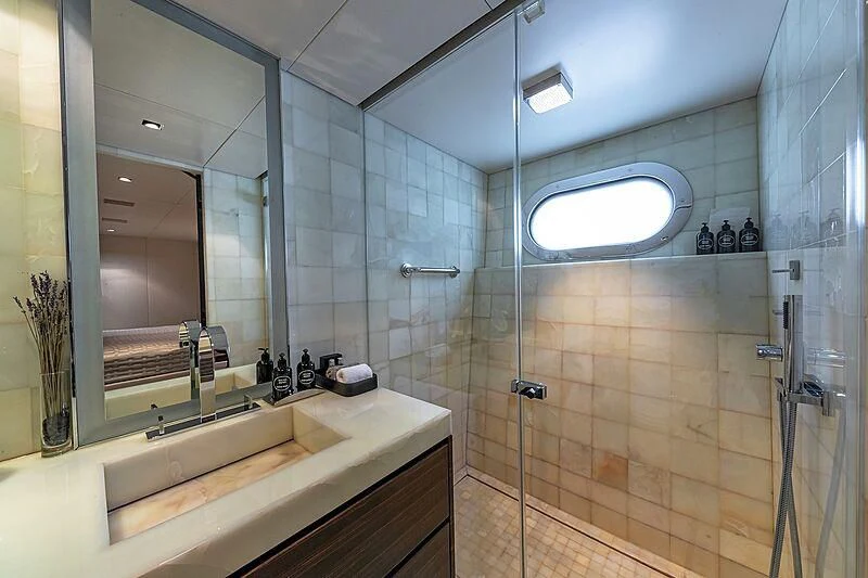 a bathroom with a glass shower aboard ODESSA Yacht for Sale