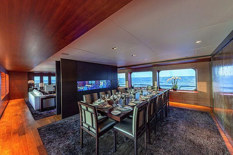 a dining room with a table and chairs aboard ODESSA Yacht for Sale
