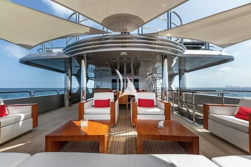 a room with a view of the ocean and the deck aboard ODESSA Yacht for Sale