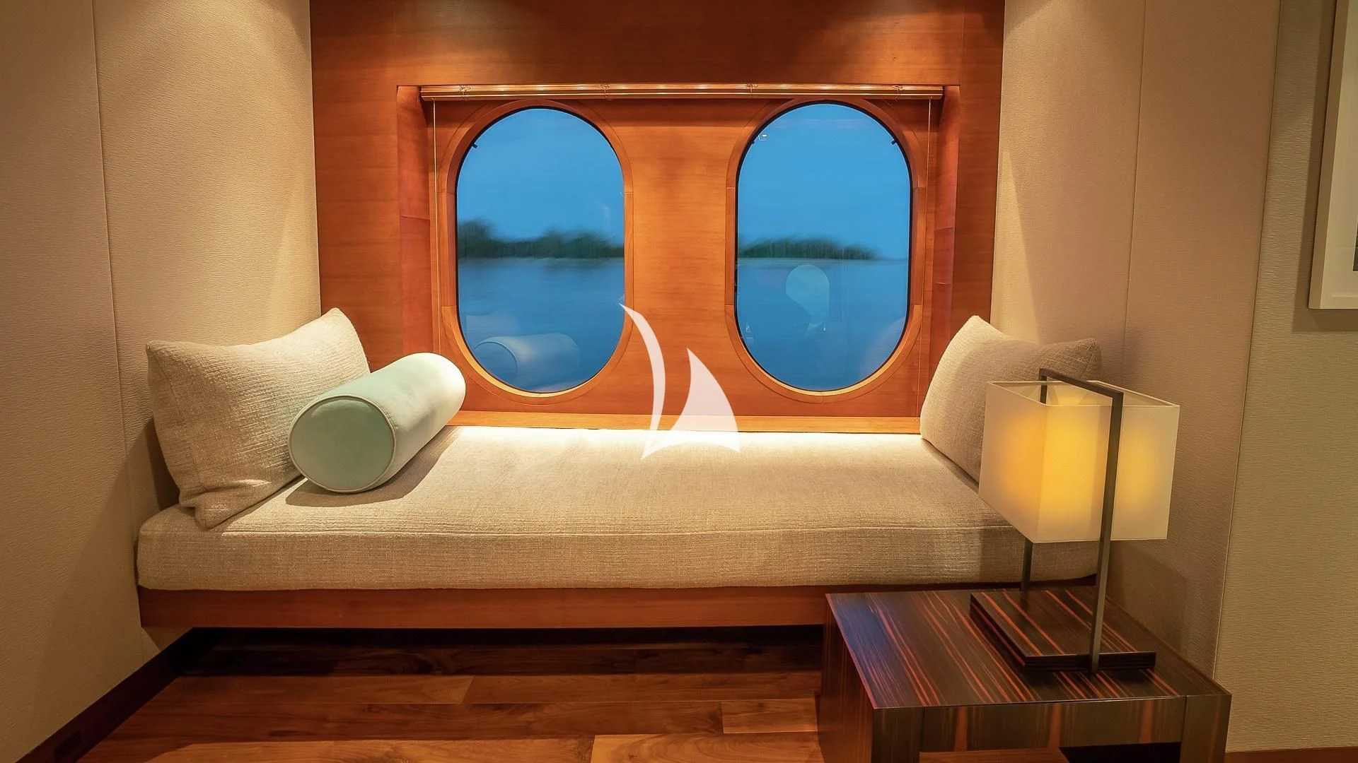 a couch with a window aboard ODESSA Yacht for Sale