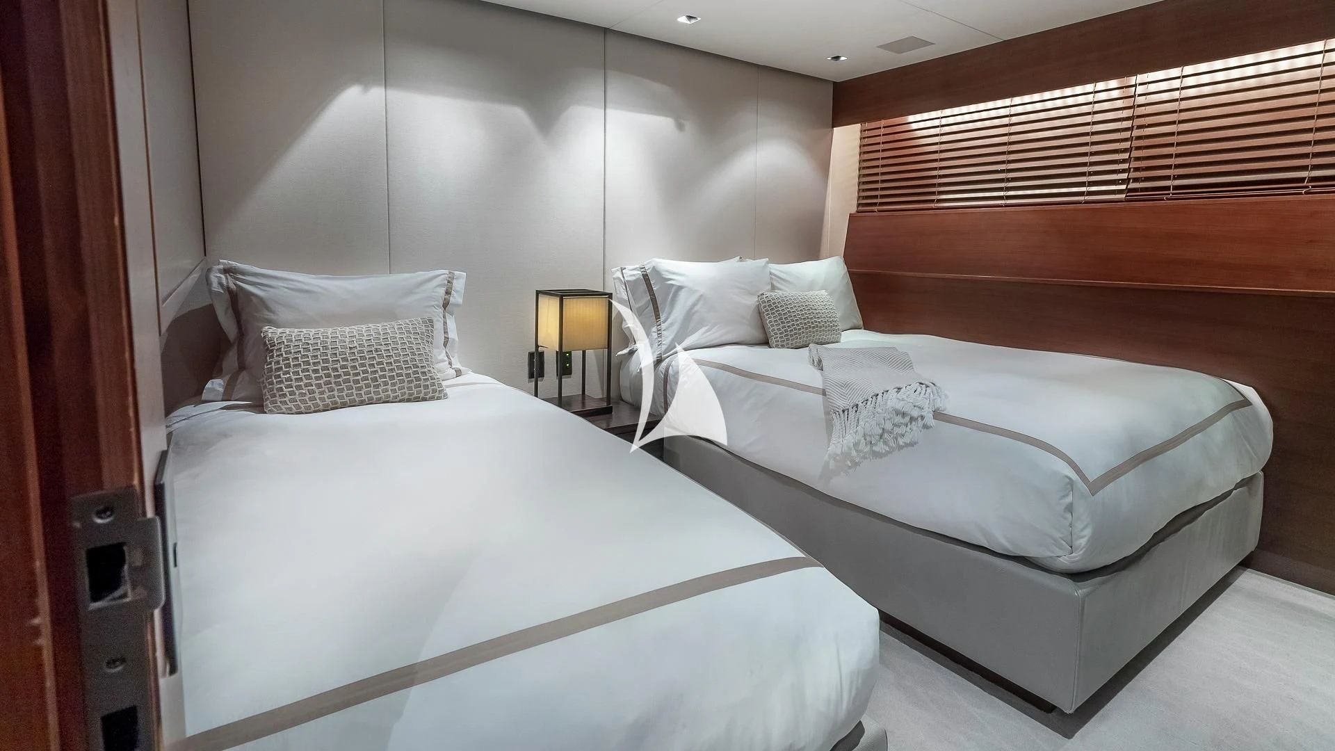 a couple of beds in a hotel room aboard ODESSA Yacht for Sale