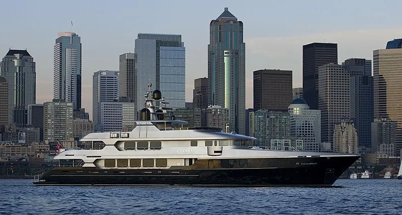 a boat in the water with a city in the background aboard ODESSA Yacht for Sale