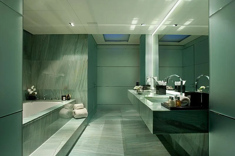 a bathroom with a tub sinks and sinks aboard ODESSA Yacht for Sale