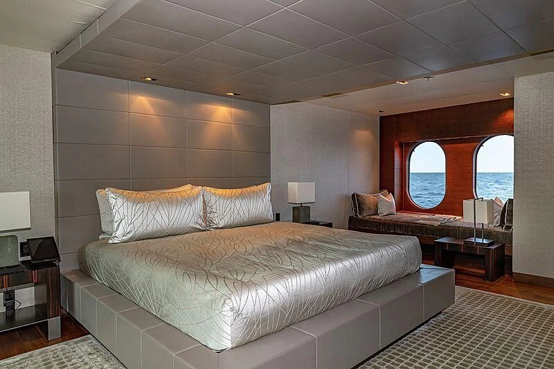 a large bedroom with a large bed aboard ODESSA Yacht for Sale