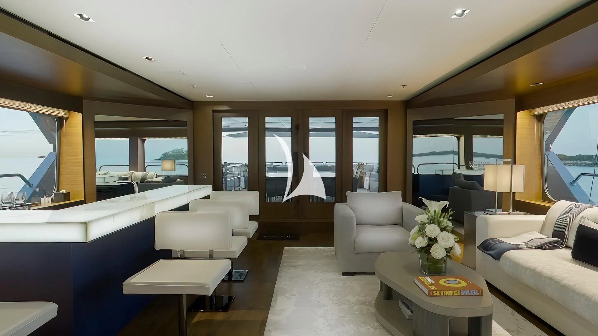 a room with a couch and a table and a window aboard ODESSA Yacht for Sale
