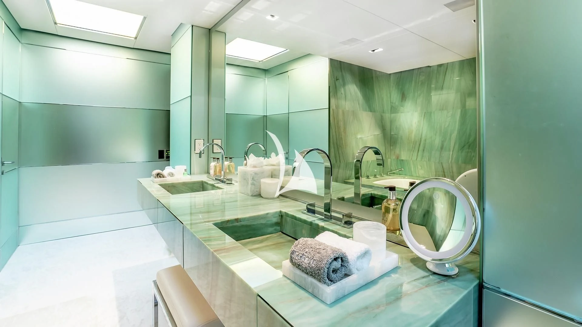 a bathroom with a large mirror aboard ODESSA Yacht for Sale