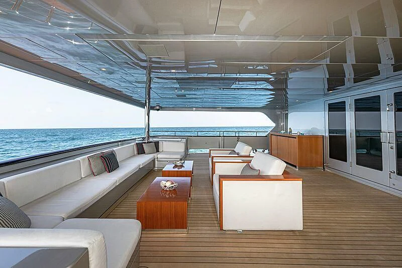 a room with a large bed and a large window aboard ODESSA Yacht for Sale