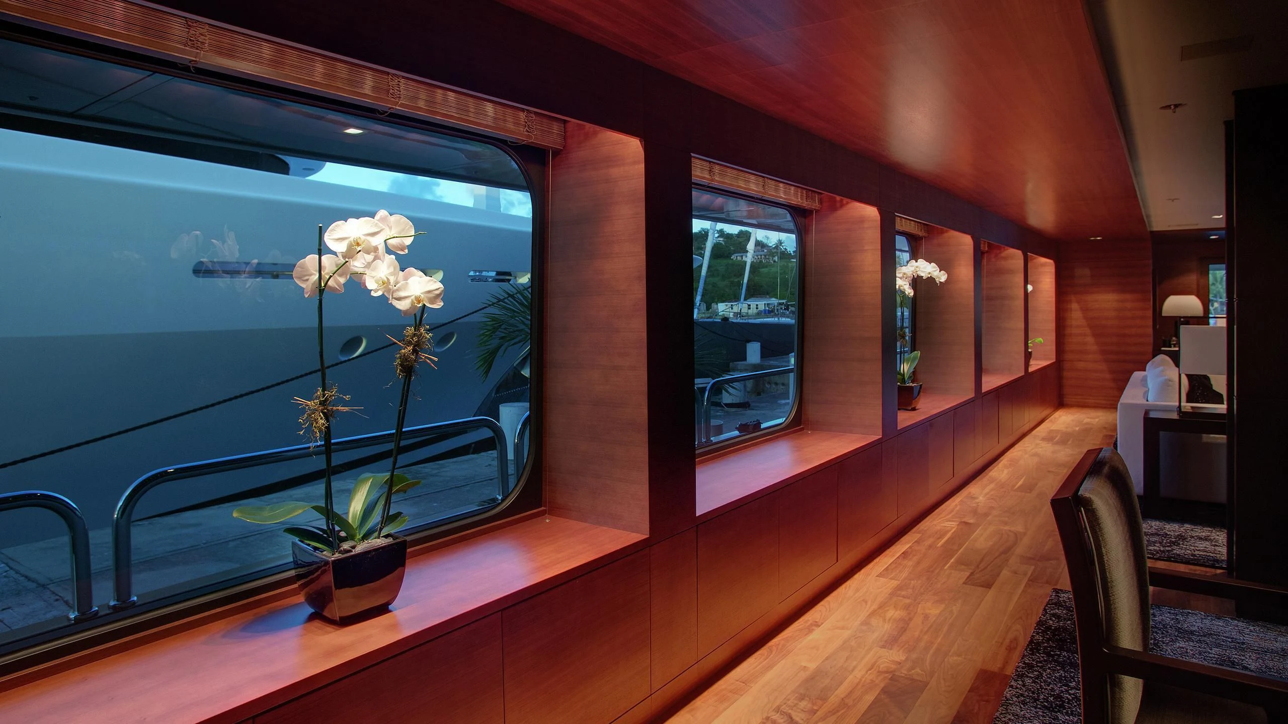 a plant in a pot on a table in a room with a window aboard ODESSA Yacht for Sale