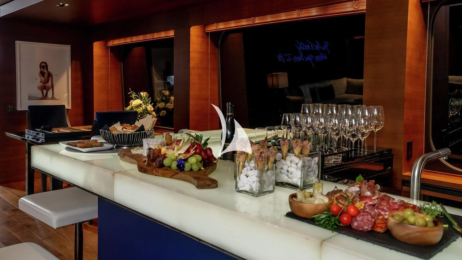 a table with food and glasses aboard ODESSA Yacht for Sale