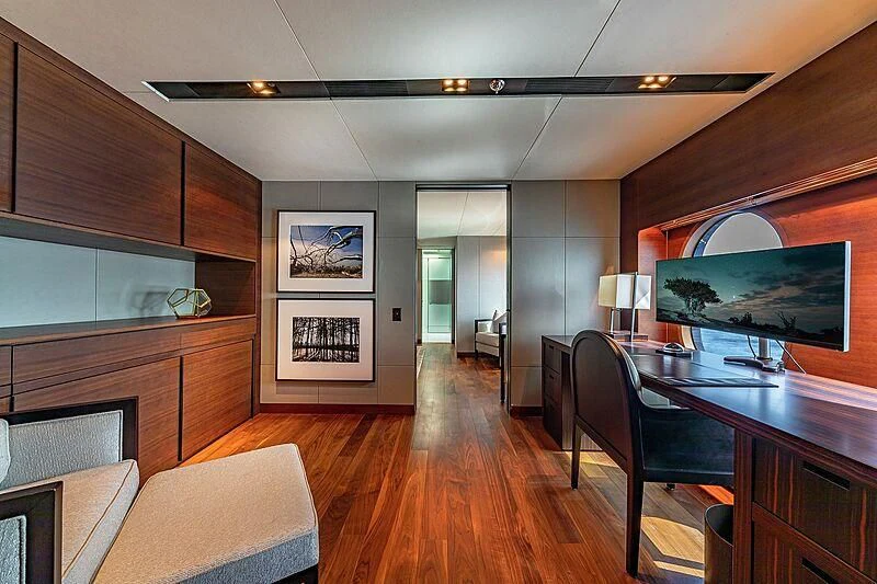 a room with a wood floor and a large television aboard ODESSA Yacht for Sale