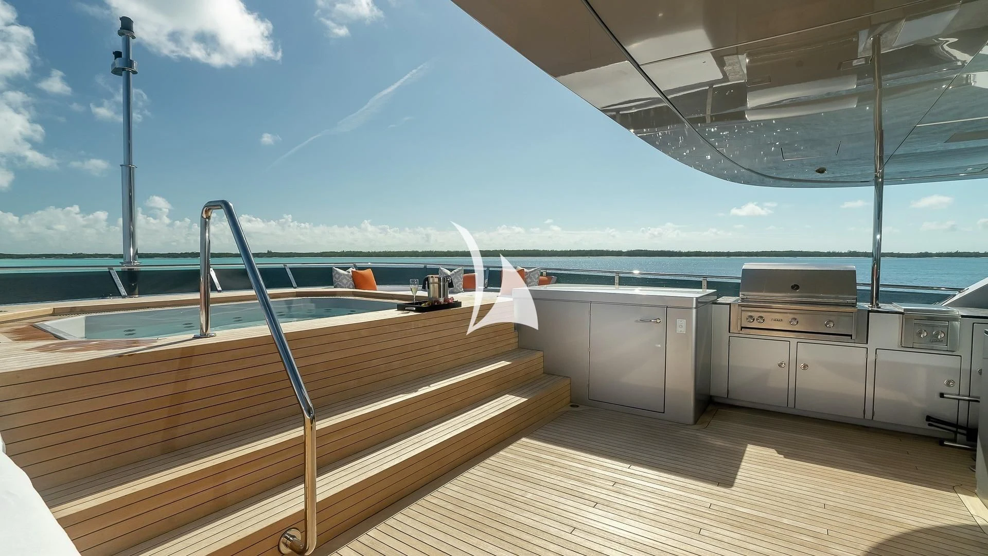 a deck with a boat and a large container on it aboard ODESSA Yacht for Sale