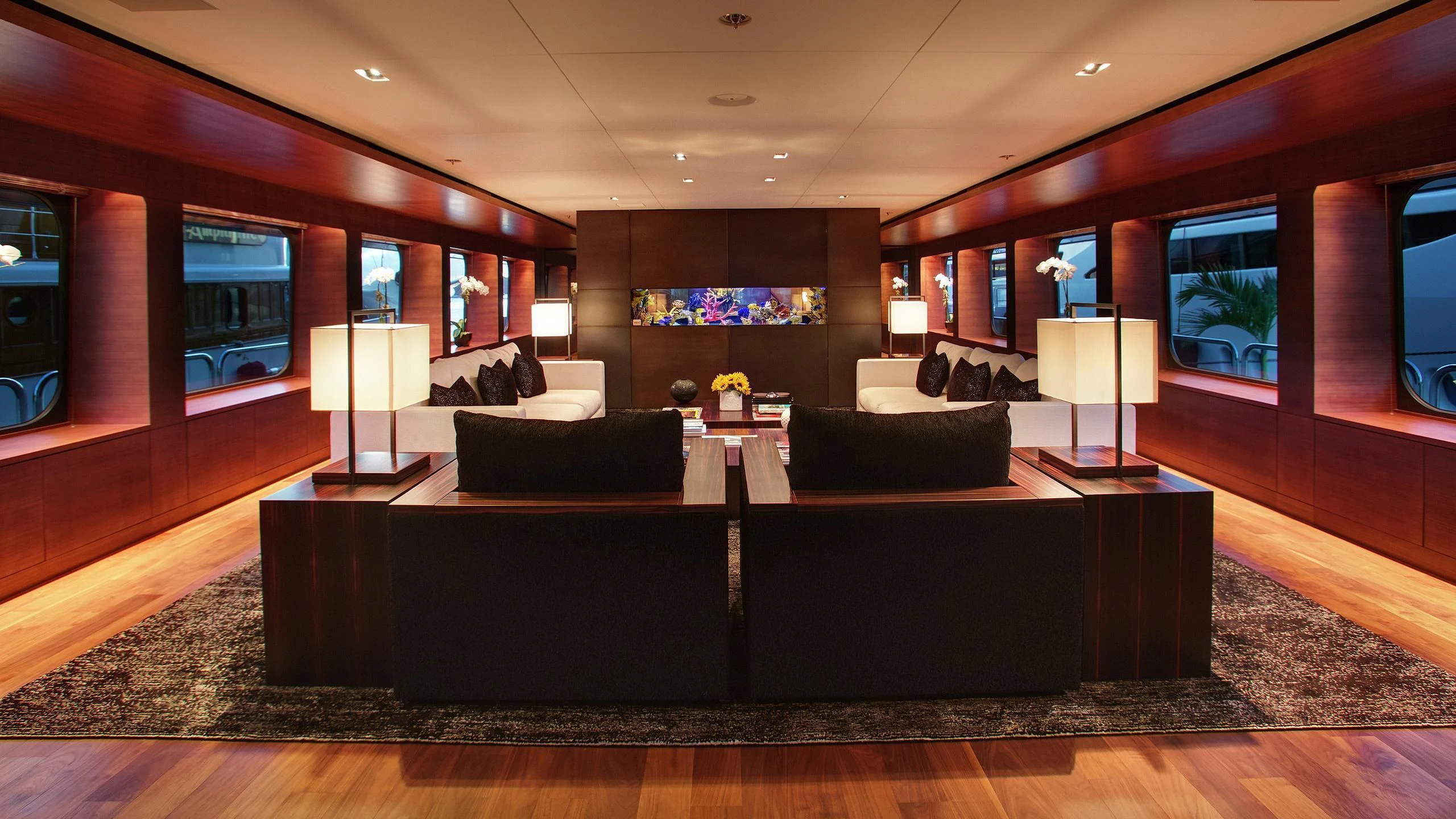 a living room with a leather couch and a tv aboard ODESSA Yacht for Sale