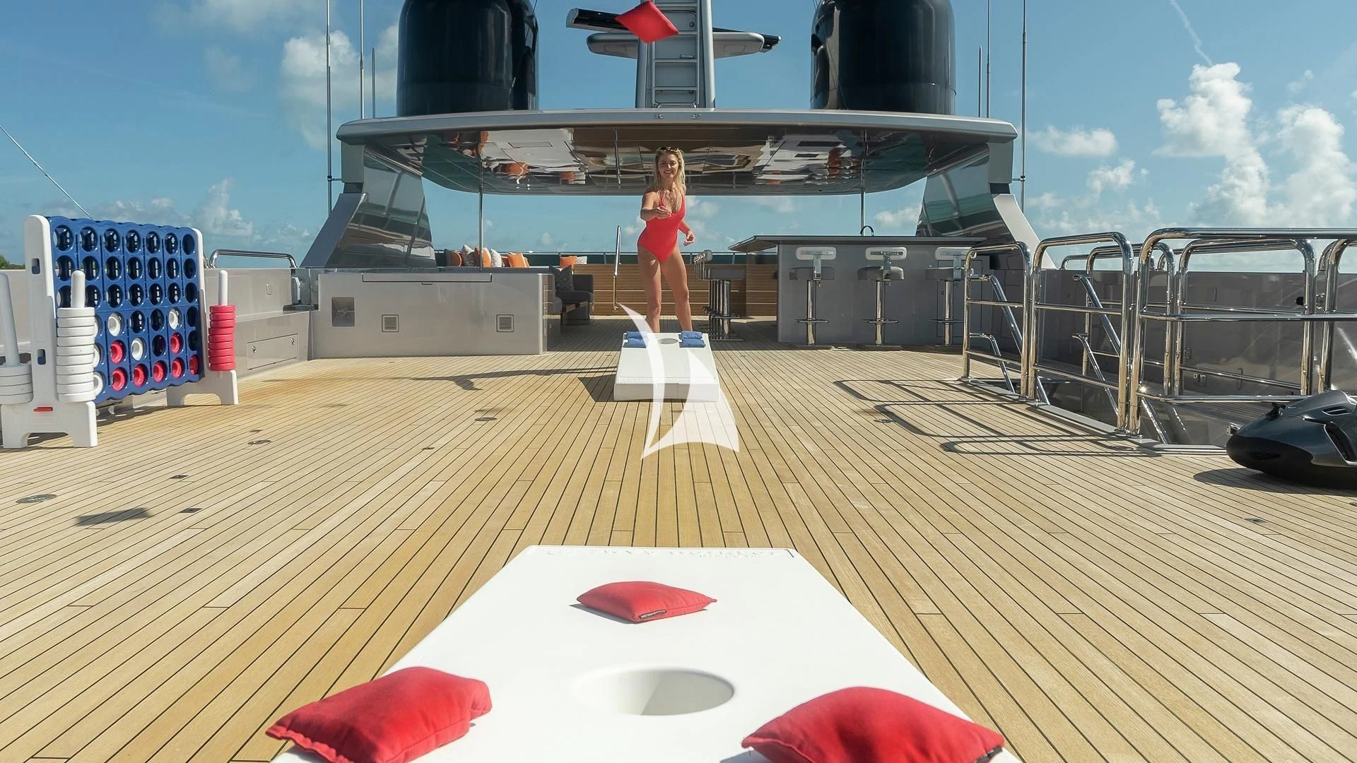 a person standing on a deck aboard ODESSA Yacht for Sale