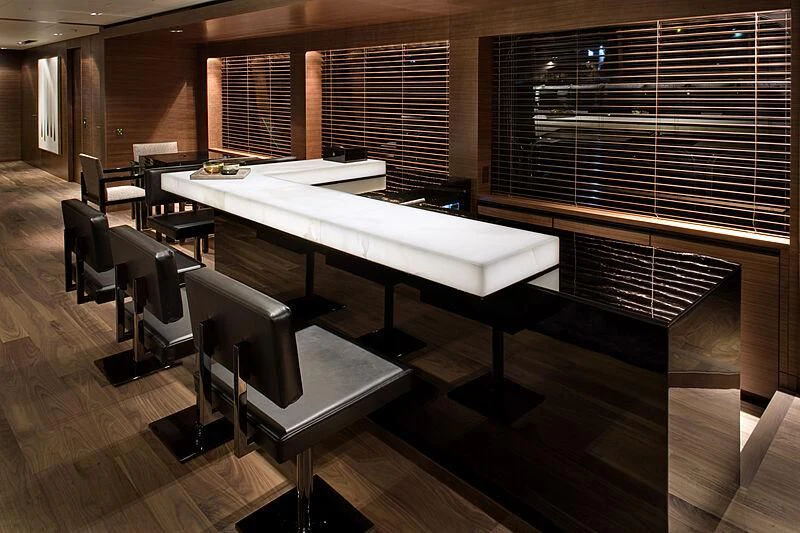 a room with a table and chairs aboard ODESSA Yacht for Sale