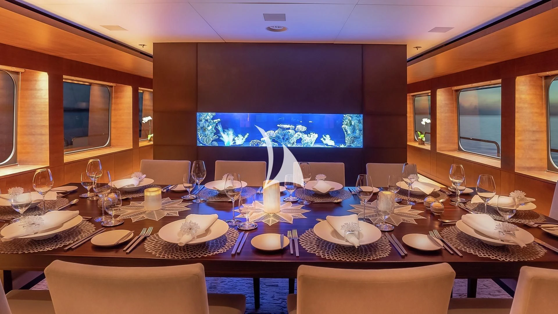 a table with plates and glasses on it aboard ODESSA Yacht for Sale