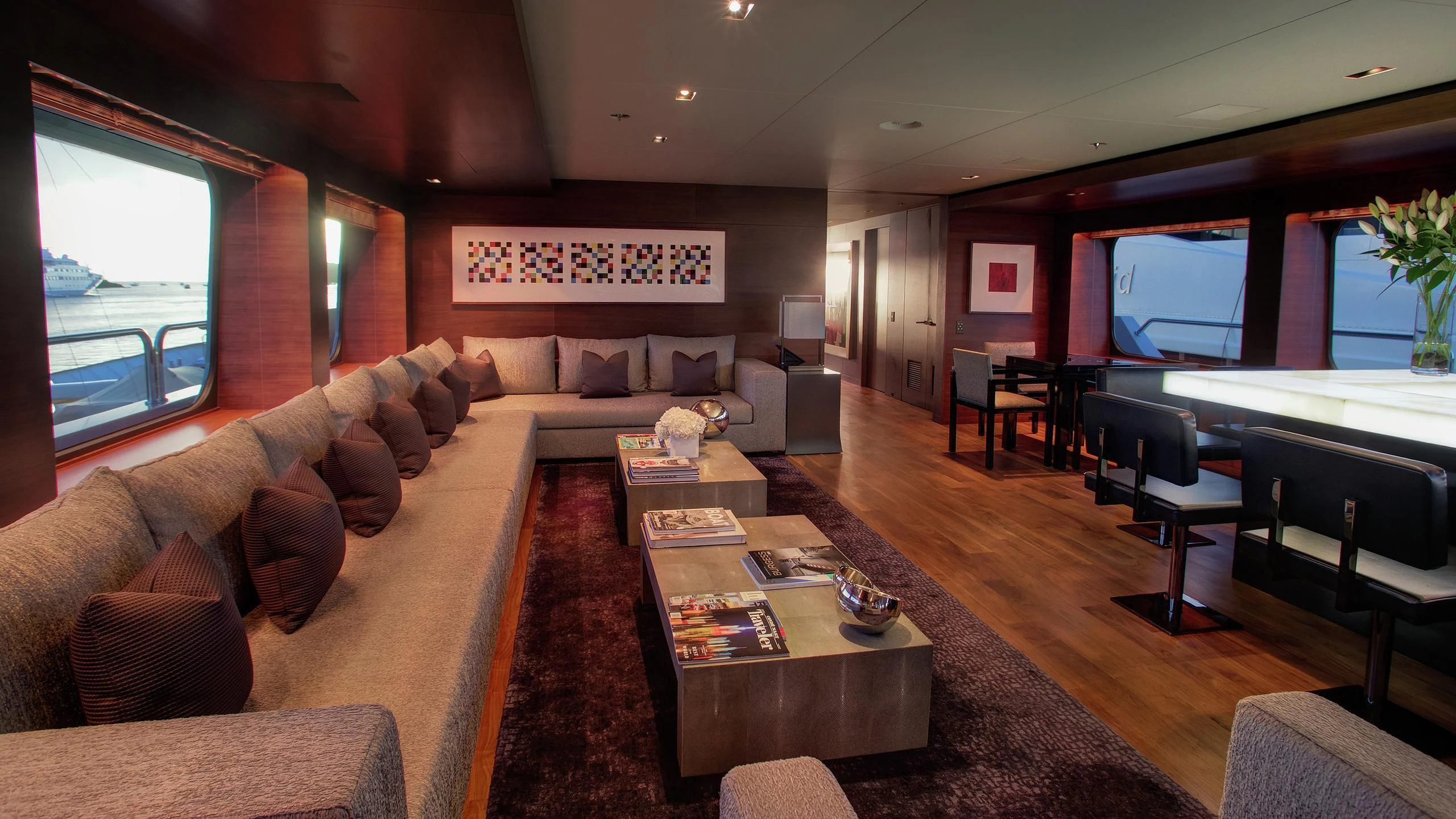 a living room with a large screen aboard ODESSA Yacht for Sale