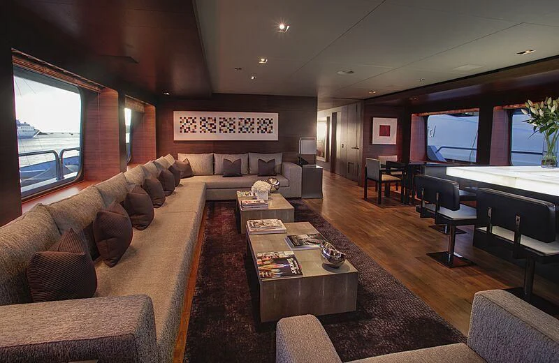 a living room with a large sofa aboard ODESSA Yacht for Sale