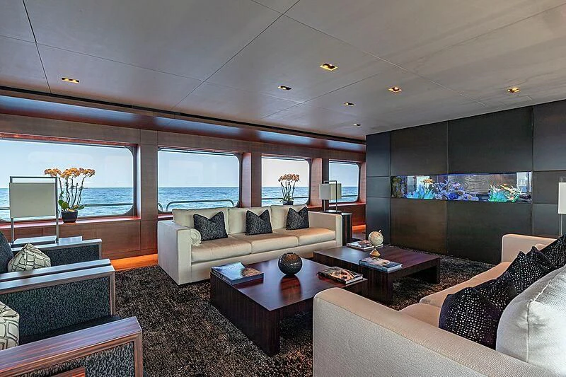 a living room with a couch and a coffee table aboard ODESSA Yacht for Sale