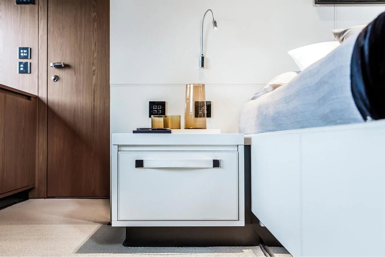 a white cabinet in a room aboard RIVA 90' ARGO Yacht for Sale