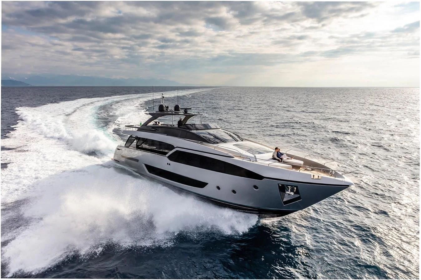 a white boat on water aboard RIVA 90' ARGO Yacht for Sale